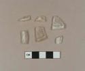 Colorless glass fragments with rolled rims, possible stemware base fragments