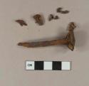 Cut or wrought iron nail; unidentified iron fragments, likely from nail