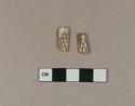 Carved, calcined animal bone fragments, possible handle; two fragments crossmend