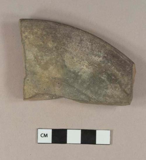 Unglazed, undecorated redware complete profile sherd