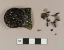 Olive green bottle glass fragment with round glass seal attached; glass fragments, heavily patinated, broken off of main fragment