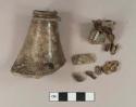 Free blown olive green bottle glass neck and finish fragments and body fragment, with iron nail fragments adhered to them; unidentified iron fragments, likely from nails