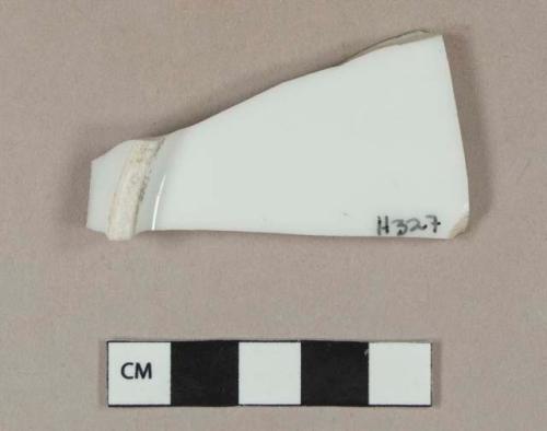 White porcelain vessel base fragment, likely plate, white paste, slight molding on interior surface