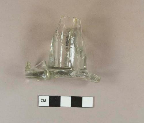 Aqua glass vessel base fragment. Embossed on base with "...NGLAND... UNI... 5, 1899. MAY 2... 899... CANADA. 534"