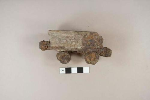 Ferrous metal toy cart fragments, corroded, 1 side with embossed "ERI[...]"