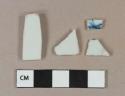 White porcelain body fragments, 1 with blue handpainted decoration
