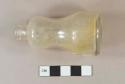 Intact colorless glass bottle, Mold seams, patent lip, "hourglass" shape, embossed on base "S.K.5792"