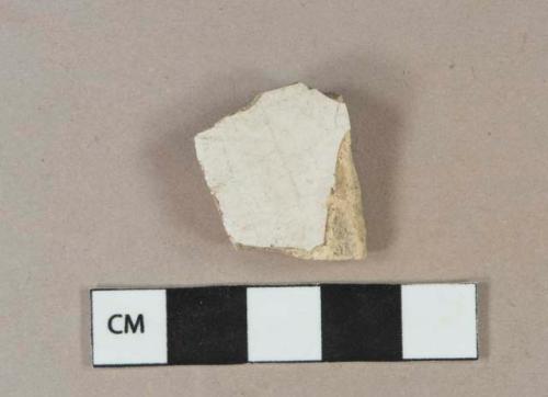 White undecorated tin-glazed earthenware vessel body fragment or tile fragment, buff paste