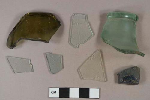 Dark olive green glass bottle  body fragments; Aqua glass bottle body and rim fragments, rolled lip; colorless glass vessel body fragments; colorless flat glass fragments; aqua flat glass fragments