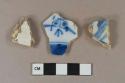 Blue on white handpainted tin-glazed earthenware vessel body fragment, buff paste