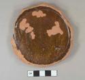 slip glazed redware base fragment, unglazed exterior