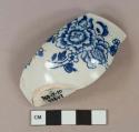 Blue on white transferprinted, likely English porcelain, tea bowl or cup, white paste, blue glaze pooling around foot ring