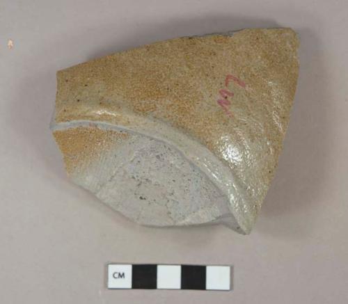 Brown salt-glazed stoneware vessel base fragment, dark brown interior, gray paste, likely bowl