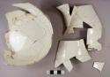 Undecorated creamware pitcher, partial vessel, white paste, 49 fragments mend