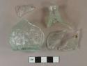 Glass, mold made, cologne, bottle; light aqua, basket weave molded decoration, rolled lip, mold blown, pontil scar; demijohn cologne bottle; Boston and Sandwich Glass Co.