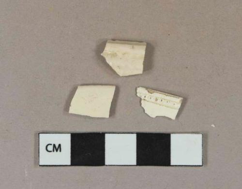 Creamware vessel rim fragments, buff paste, 2 fragments with molded decorations