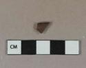 Dark brown lustrous salt-glazed stoneware vessel rim fragment, gray paste, likely Nottingham type