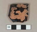 Dark brown lead glazed redware vessel rim fragment