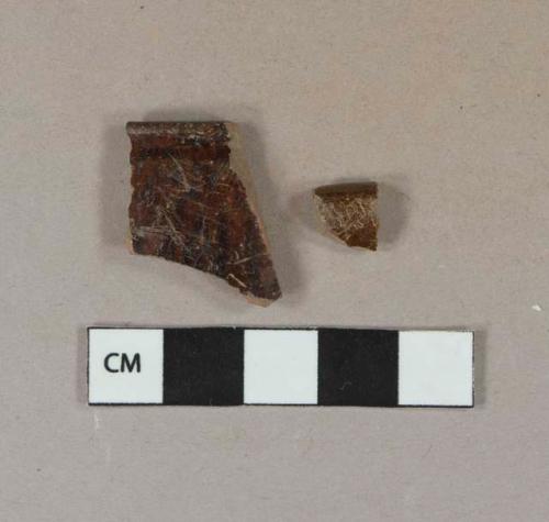 Dark brown manganese mottled redware vessel rim fragments