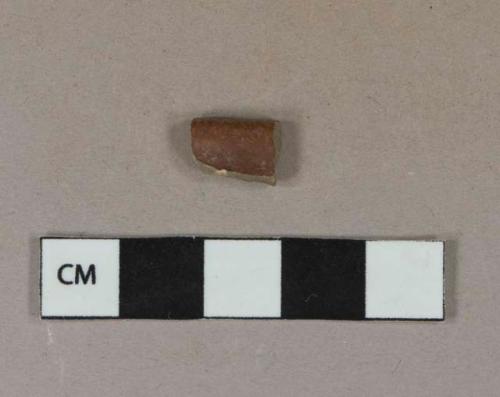 Brown lustrous salt-glazed stoneware vessel rim fragment, gray paste, likely Nottingham type