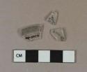 Colorless glass vessel rim fragments, 1 fragment folded rim