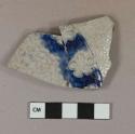 Gray salt-glazed stoneware vessel body fragment, cobalt decorated, molded decoration, gray paste