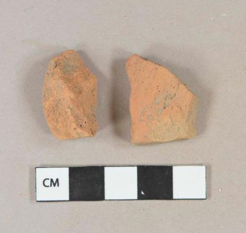 Red brick fragment, unglazed redware vessel body fragment