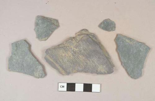 Dark gray slate fragments, likely roof slate, 1 fragment with broken hole with diameter of 0.6 cm