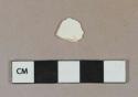 Undecorated whiteware vessel rim fragment, possibly pearlware, white or very light buff paste