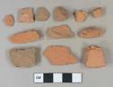 Red brick fragments, unglazed redware roof tiles