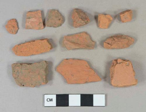 Red brick fragments, unglazed redware roof tiles