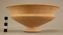 Carinate pottery bowl - flaring rim; low spreading hollow foot;