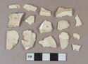 Creamware vessel body and rim fragments, light buff or white paste, 1 fragment with molded decoration
