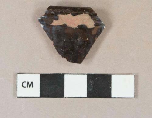 Dark brown lead glazed redware vessel rim fragment