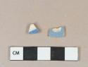 Blue and white pearlware vessel body fragments, white or light buff paste, possible factory decorated slipware