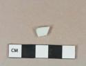 White porcelain vessel body fragment, slight portion of blue decoration, white paste