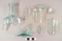 Glass, mold made, bottle, medicinal; light aqua, rectangular, fragments, paneled with embossed lettering on each side, "SARSA..." ; "COMPOUND..." / "...T." / "...ELL / S.U.S.A.", Hood's Sarsaparilla Compound, Lowell, MA