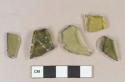 Light olive green vessel body fragments, likely bottle