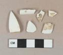 White lead-glazed ironstone vessel body and rim fragments, white paste