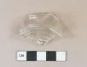 Colorless glass vessel base, likely paneled tumbler fragment