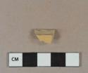 Yellow lead glazed refined earthenware vessel body fragment, buff paste