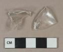 Colorless vessel glass fragments, likely bottle base and shoulder fragments