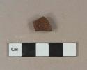 Lustrous brown saltglazed stoneware vessel body fragment, gray paste, likely Nottingham type