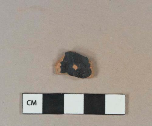 Dark brown opaque lead glazed redware vessel body fragment