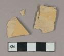 Undecorated buff lead glazed earthenware vessel body fragments, buff paste, likely mochaware