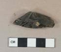 Dark olive green glass vessel fragment, likely wine bottle neck fragment