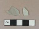 Light aqua vessel glass body fragment; light aqua flat glass fragment, both weathered