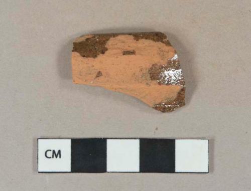 Dark brown lead glazed redware vessel rim fragment