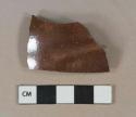 Lustrous dark brown salt glazed stoneware vessel body fragment, gray paste, likely nottingham type
