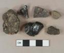 Coal fragments, 1 burned; 2 asphalt fragments with brick inclusions; 1 slag fragment